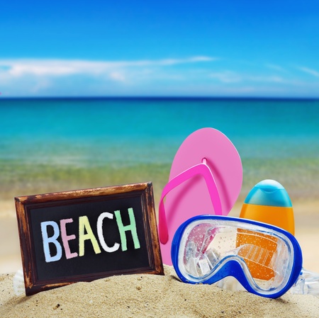 blackboard with the words beach and other things for the rest against the blue seaの写真素材
