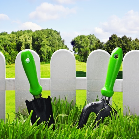 garden tools on the lawn of the house in a landscapeの写真素材