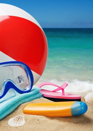 beach accessories on a background of sea and sandの写真素材