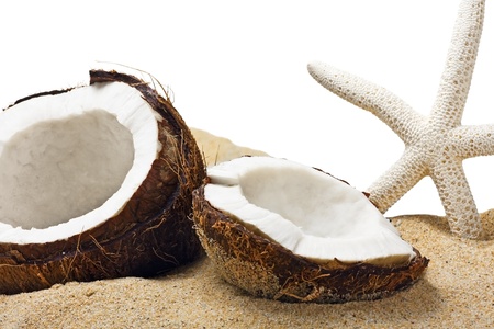 chopped coconut in the sand isolated on white backgroundの写真素材