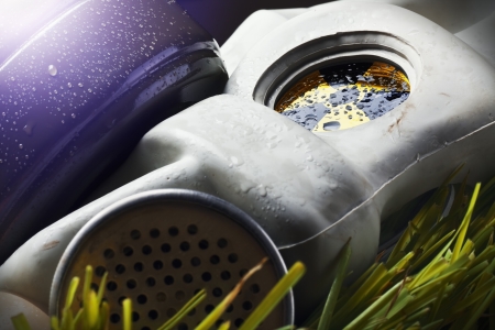 Gas mask with radiation sign on contaminated landの写真素材