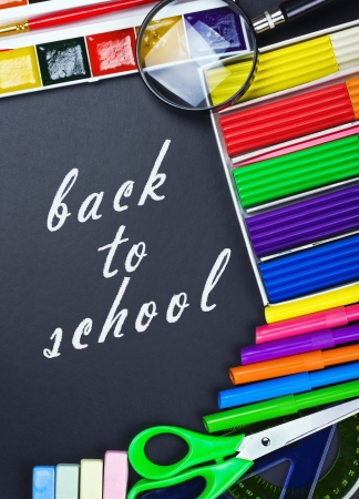 written on the blackboard back to school and supplies for schoolの写真素材