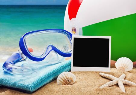 beach accessories on a background of sea and sandの写真素材