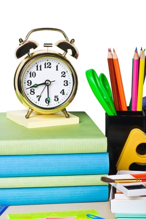 alarm clocks and school supplies isolated on white backgroundの写真素材