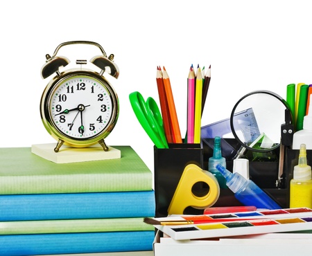 alarm clocks and school supplies isolated on white backgroundの写真素材