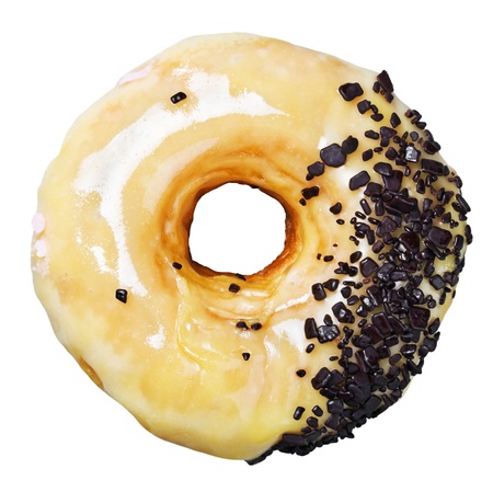 donut with caramel and chocolate chips isolated on white backgroundの写真素材