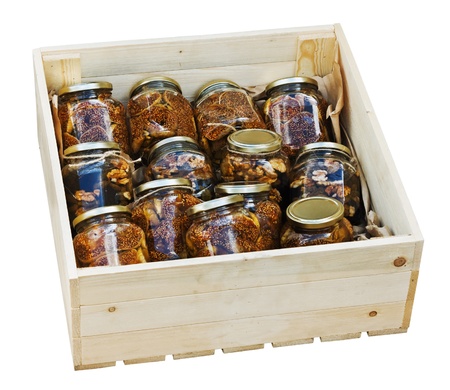canned jams with nuts and dried fruit isolated on white backgroundの写真素材