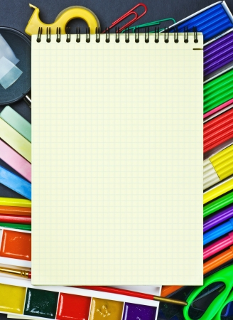 notepad lies on the school supplies to the school boardの写真素材