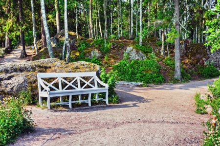 white decorative bench for relaxing in the parkの写真素材