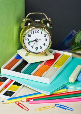 alarm clocks and school supplies on the backgroundの写真素材