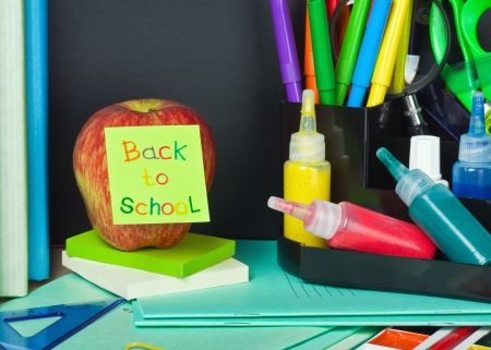 paper sticker with text back to school pasted on the appleの写真素材