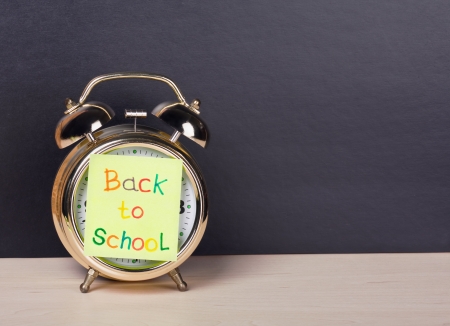 alarm clock and sticker with text back to schoolの写真素材