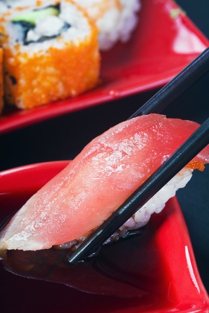 tuna sushi in soy sauce dropsの写真素材