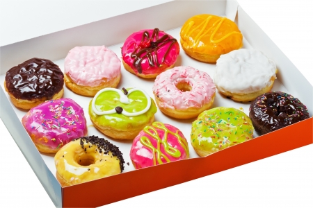 Box full of doughnuts isolated on white backgroundの写真素材