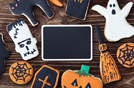 handmade cookies for Halloween and the black plate for greetings. The empty space on the plate can be used for writing or drawing particular congratulations.の写真素材