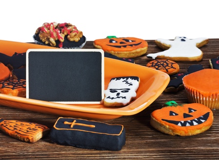 Halloween cookies on a plate orange and black sign for the congratulatory textの写真素材