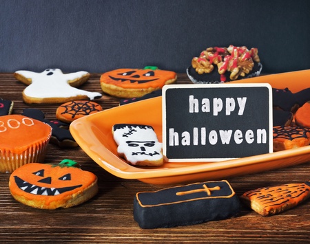 Halloween cookies on a plate orange and holiday greetingsの写真素材
