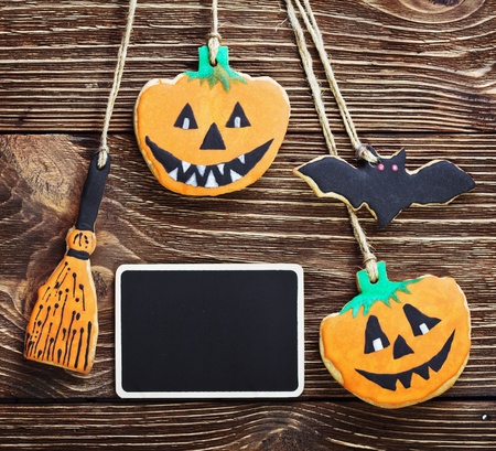 handmade cookies for Halloween and the black plate for greetings. The empty space on the plate can be used for writing or drawing particular congratulations.の写真素材