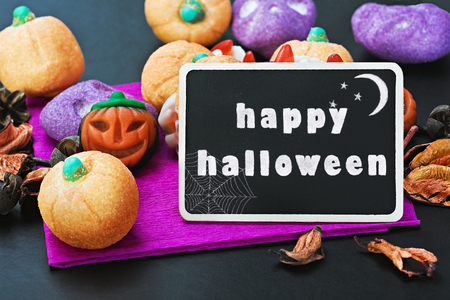 candy for Halloween and blackboard with congratulationsの写真素材