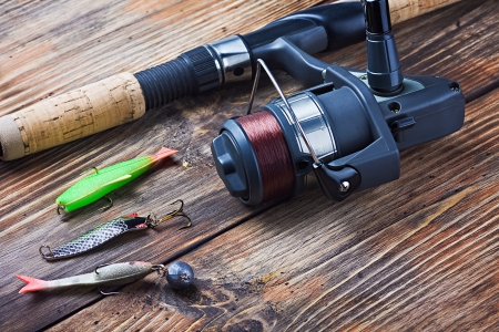fishing tackle on a wooden table の写真素材