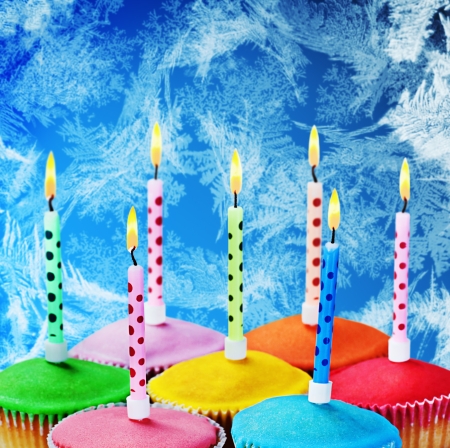 burning candles on a cake to celebrateの写真素材