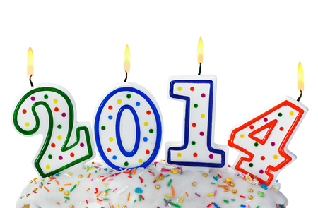 burning candles with the symbol of the new year 2014 on a white backgroundの写真素材