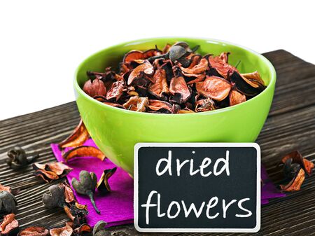 dried flowers on a wooden table and blackboardの写真素材