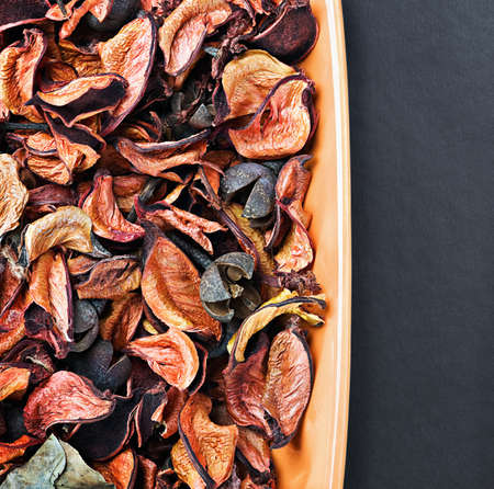 dry flowers in shades of orange on a black backgroundの写真素材