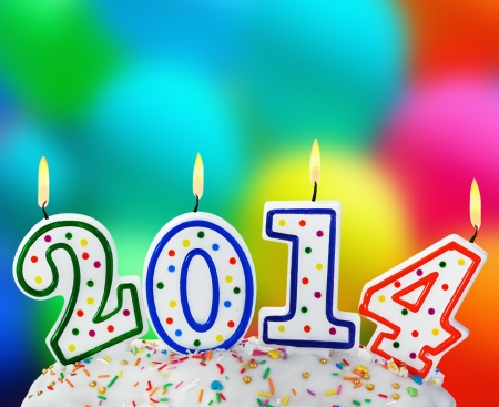 burning candles with the symbol of the new year on the cakeの写真素材