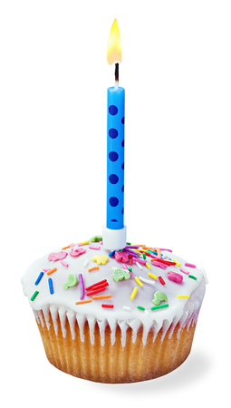 cupcakes with a birthday candle isolated on a white backgroundの写真素材