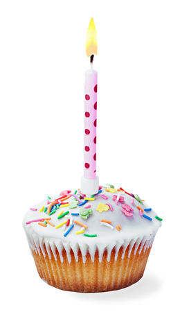 cupcake with a birthday candle isolated on a white backgroundの写真素材