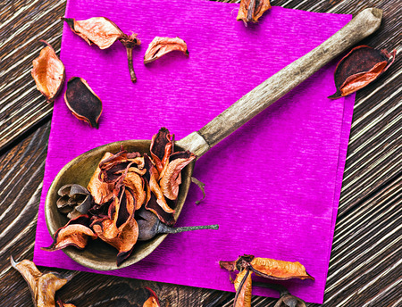 Old wooden spoon and orange dry flowersの写真素材