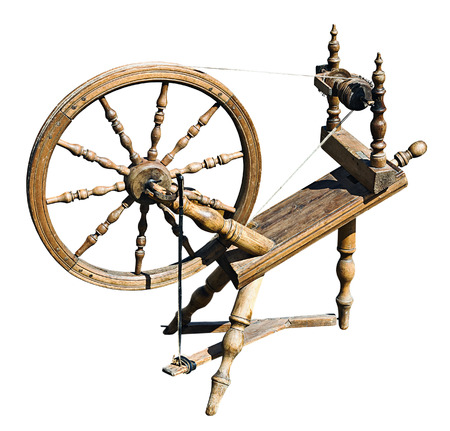 old wooden spinning wheel isolated on white backgroundの写真素材