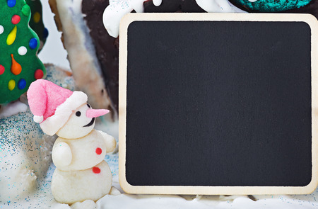 Christmas decoration of sweets and cakes and a blackboardの写真素材