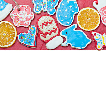 Christmas gingerbread on a red and a place for congratulationsの写真素材