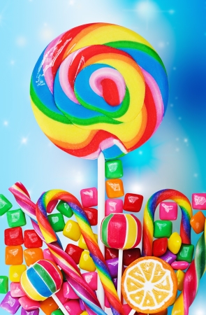 Colorful candies and sweets on a colored 
の写真素材