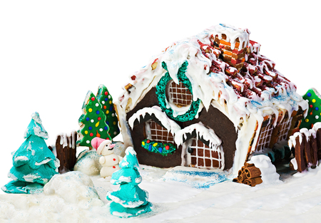 gingerbread house and candy for the holiday merry christmas on white の写真素材