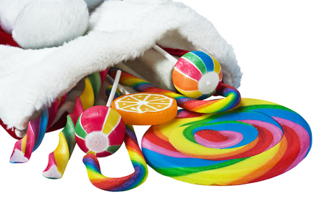 colorful candy in a Christmas sock isolated on white の写真素材