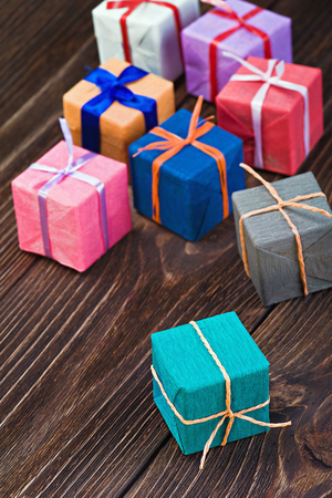 gift boxes in a colorful package on the tableの写真素材