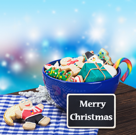 Christmas gingerbread cookies and a blackboard with congratulationsの写真素材