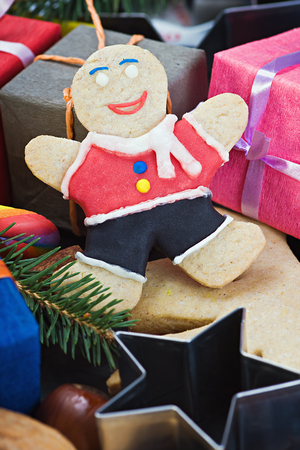 smiling on the background of Christmas gingerbread decorations for the holidayの写真素材