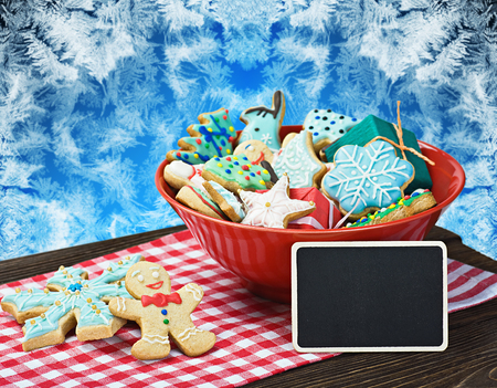 Christmas gingerbread cookies and a blackboard with congratulationsの写真素材