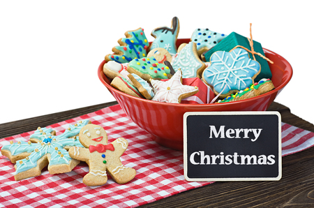 Christmas gingerbread cookies on the table isolated on white の写真素材