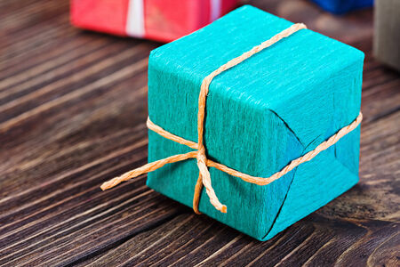 gift box in a colorful package on the tableの写真素材