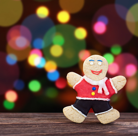 Smiling gingerbread men on a colored backgroundの写真素材