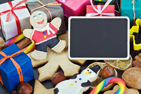 smiling on the background of Christmas gingerbread decorations for the holidayの写真素材
