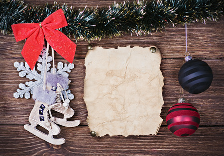 Christmas toys and old Paper the on wooden backgroundの写真素材