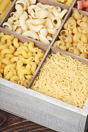 Italian pasta assortment of different colors background. Focus on foreground pastaの写真素材
