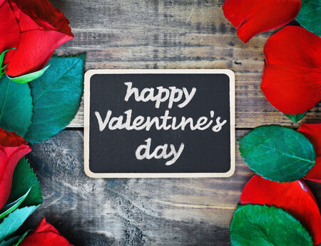 red roses and blackboard for congratulationの写真素材