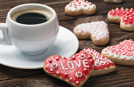 Heart shaped cookies baked on valentines day and a cup of coffeeの写真素材